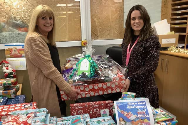 Ann Rowston and Katy Royal get send to distribute the gifts through Ashley Primary School, South Shields.