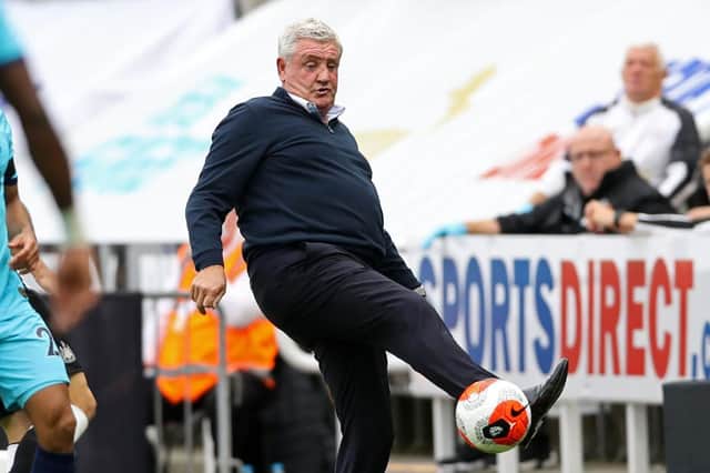 Newcastle United's English head coach Steve Bruce controls the ball on the touchline during the English Premier League football match between Newcastle United and Tottenham Hotspur at St James' Park in Newcastle-upon-Tyne, north-east England on July 15, 2020.