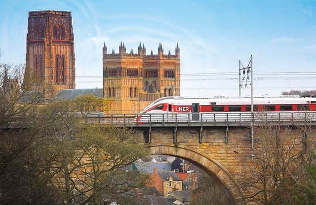 An LNER train passes through Durham on the East Coast Main Line