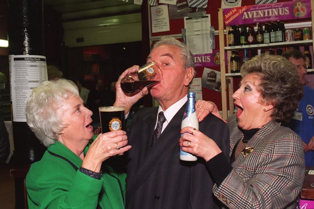 Frank and Jean Fielding (left), former landlord and lady of the Pear Tree pub on Frog Lane  officially opened the Tenth Wigan Beer Festival, being held at The Mill At The Pier, and got stuck in straight away to the various brews.  Looking on, aghast, is Jean's sister Lilly Swift.