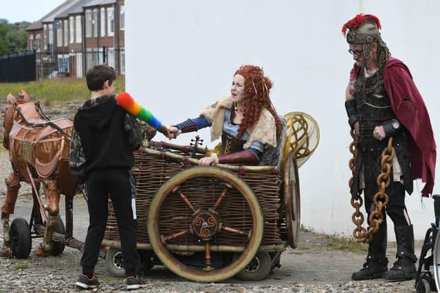 The Wheelabouts as Queen Boudicca at Arbeia Roman Fort, South Shields on Saturday. The Queen is seen dusting off a Roman watched by her Roman slave Slavious.