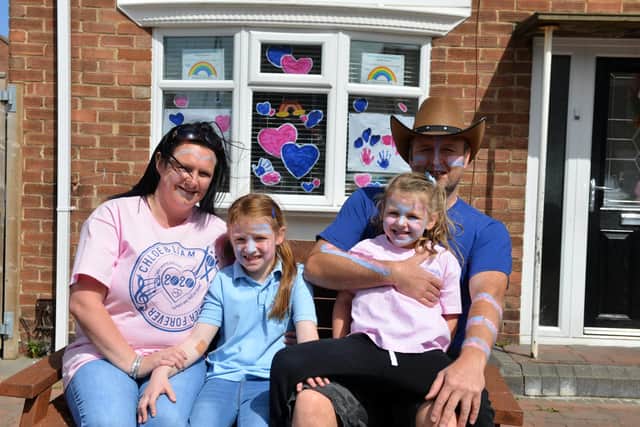 Rubens Avenue residents Claire Graham, Keith Newton and daughters Katie, 7 and Emily, 4. Claire was once Liam's teacher.