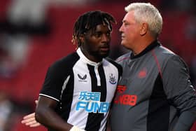 Newcastle United's Allan Saint-Maximin and head coach Steve Bruce at the Keepmoat Stadium.