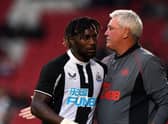 Newcastle United's Allan Saint-Maximin and head coach Steve Bruce at the Keepmoat Stadium.