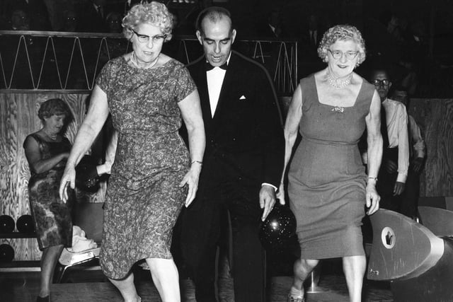 A scene from 1963 showing tenpin bowling instruction at the Dog's Bowl in South Tyneside. Showing Mrs M Dodds, left, and Mrs T W Peel the correct ball delivery is Mr F J Bright, centre manager.