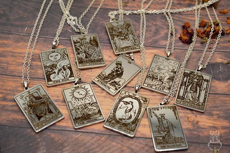 Hexscandal sells jewellery with a witchy theme. These are Major Arcana Tarot Card Pendants.