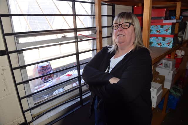 Cardstation employee Diane Hatch in the upstairs stock room of the shop, which has had two of its windows smashed in the early hours of the morning.