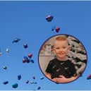 The loved ones of little Robbie Elliott have released ballloons in his memory.