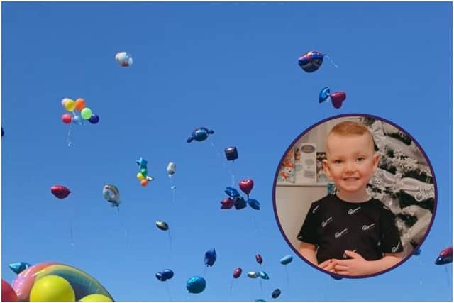 The loved ones of little Robbie Elliott have released ballloons in his memory.