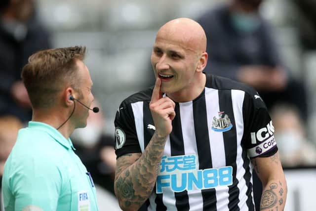 Jonjo Shelvey points to a missing tooth against Sheffield United.