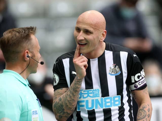 Jonjo Shelvey points to a missing tooth against Sheffield United.