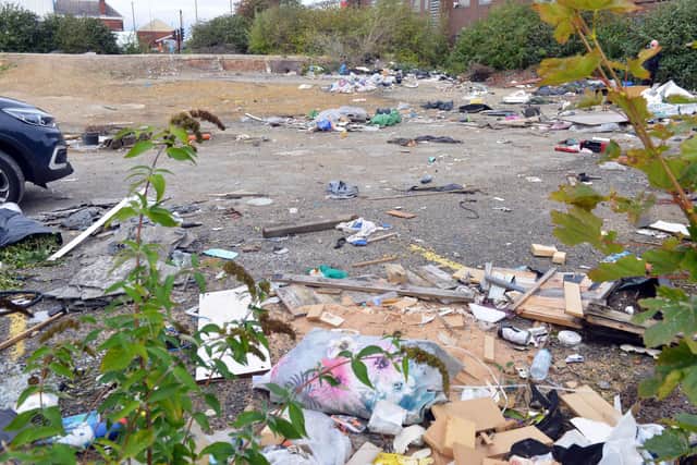 Piles of rubbish are strewn across the empty land at Crossgate.