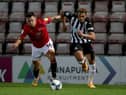 John O'Sullivan of Morecambe battles for possession with Newcastle United's Joelinton.