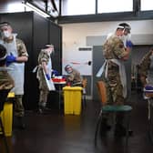 British Army soldiers, 1st battalion Coldstream Guards, staff a coronavirus testing centre set up at the Merseyside Caribbean Council Community Centre in Liverpool, north west England, on November 10, 2020 during a city-wide mass testing pilot operation. -