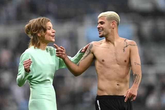 Newcastle player Bruno Guimaraes shares a joke with co-owner Amanda Staveley on the pitch after the Premier League match between Newcastle United and Arsenal at St. James Park on May 16, 2022 in Newcastle upon Tyne, England. (Photo by Stu Forster/Getty Images)