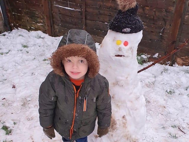 Julie Michelle Kain sent in this photo of her son and his snow man.