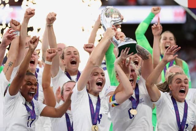 Leah Williamson and Millie Bright of England lift the UEFA Women’s Euro 2022 trophy. Picture: Naomi Baker/Getty Images.
