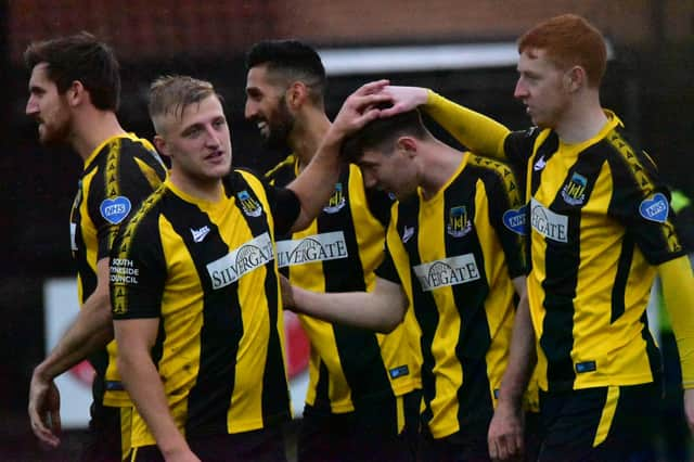 Hebburn players celebrate a goal.