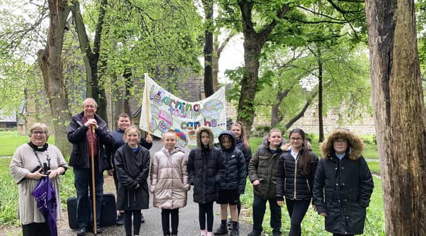 Revd Lesley Jones and Bishop Paul (left) alongside the Jarrow students.
