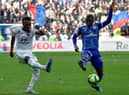Lyon's Burkinabe forward Bertrand Traore (L) fights for the ball with Strasbourg's Ivorian forward Kevin Zohi (R) during the French L1 football match between Lyon (OL) and Strasbourg (RCSA) on February 16, 2020 at the Groupama Stadium in Decines-Charpieu near Lyon, southeastern France. (Photo by JEAN-PHILIPPE KSIAZEK / AFP) (Photo by JEAN-PHILIPPE KSIAZEK/AFP via Getty Images)