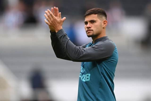 Newcastle United midfielder Bruno Guimaraes applauds fans after the Bournemouth game.