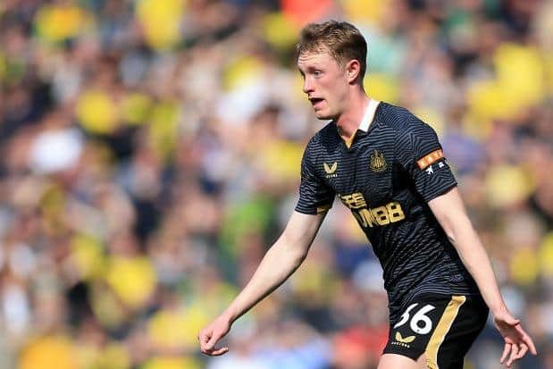 Sean Longstaff playing for Newcastle United at Carrow Road.