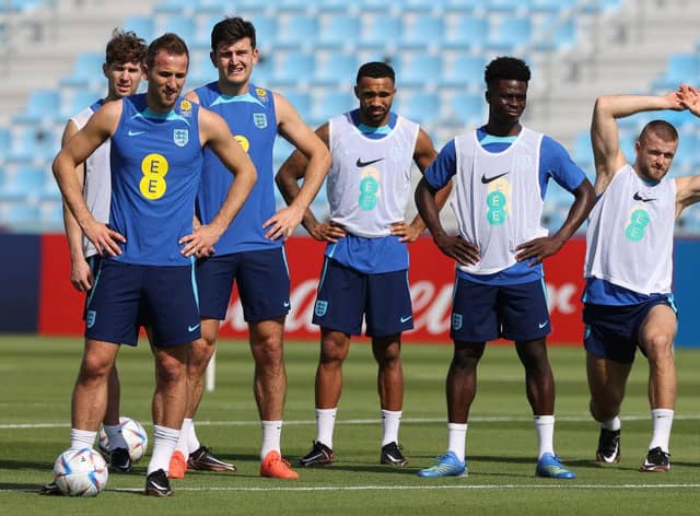 England captain Harry Kane (l) alongside John Stones, Harry Maguire , Callum Wilson, Bukayo Sako and Eric Dier during the England Training session at Al Wakrah Stadium on November 17, 2022 in Doha, Qatar. (Photo by Michael Steele/Getty Images)