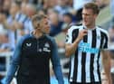 Dan Burn is taken off against Manchester City with a head injury.