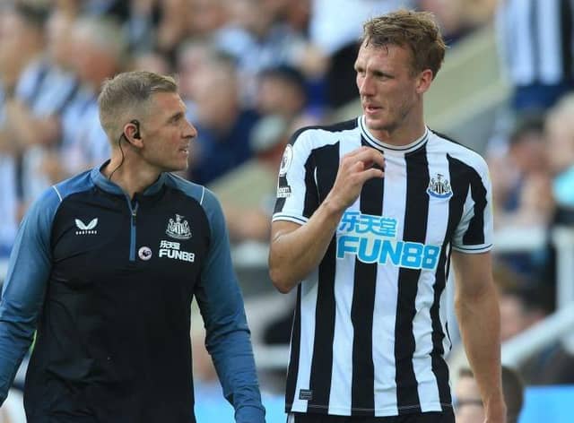 Dan Burn is taken off against Manchester City with a head injury.