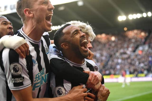 Newcastle striker Callum Wilson celebrates with team mates after scoring the second Newcastle goal during the Premier League match between Newcastle United and Manchester United at St. James Park on April 02, 2023 in Newcastle upon Tyne, England. (Photo by Stu Forster/Getty Images)