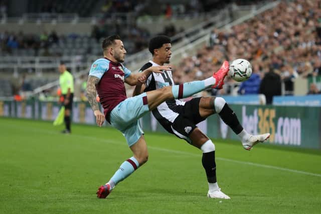 Josh Brownhill of Burnley battles for possession with Jamal Lewis of Newcastle United. (Photo by Ian MacNicol/Getty Images)
