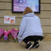 A Customs House colleague pays tribute to Karen Ratcliffe by leaving flowers outside of arts venue in South Shields.