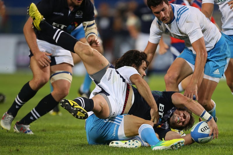 August 22, 2015: Italy 12, Scotland 16, summer test
Former Melrose player Peter Horne being tackled at the Stadio Olimpico in Turin (Photo: Marco Bertorello/AFP via Getty Images)