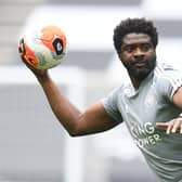 Leicester City's first team coach Kolo Toure warms up the players ahead of the Premier League game against Tottenham Hotspur.