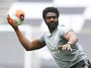 Leicester City's first team coach Kolo Toure warms up the players ahead of the Premier League game against Tottenham Hotspur.