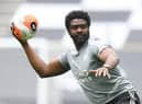 Leicester City's first team coach Kolo Toure warms up the players ahead of the Premier League game against Tottenham Hotspur.
