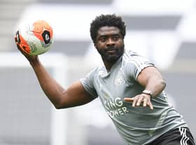 Leicester City's first team coach Kolo Toure warms up the players ahead of the Premier League game against Tottenham Hotspur.
