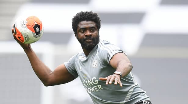 Leicester City's first team coach Kolo Toure warms up the players ahead of the Premier League game against Tottenham Hotspur.
