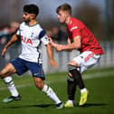 Dilan Markanday of Tottenham Hotspur battles for possession with Ethan Galbraith of Manchester United.
