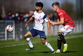 Dilan Markanday of Tottenham Hotspur battles for possession with Ethan Galbraith of Manchester United.