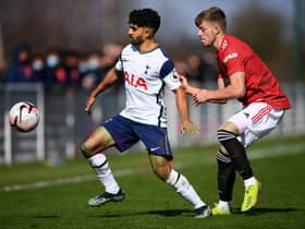 Dilan Markanday of Tottenham Hotspur battles for possession with Ethan Galbraith of Manchester United.