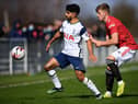 Dilan Markanday of Tottenham Hotspur battles for possession with Ethan Galbraith of Manchester United.