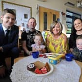 Cllr Adam Ellison (left) at Stanley's Nursery with Nathan and Samantha Young, their children Louisiana and Tommy-Paul, and nursery manager Andrea King (centre).