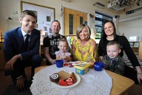 Cllr Adam Ellison (left) at Stanley's Nursery with Nathan and Samantha Young, their children Louisiana and Tommy-Paul, and nursery manager Andrea King (centre).