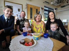 Cllr Adam Ellison (left) at Stanley's Nursery with Nathan and Samantha Young, their children Louisiana and Tommy-Paul, and nursery manager Andrea King (centre).