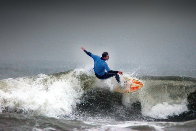 A lone surfer rides a wave at Sandhaven in 2004.