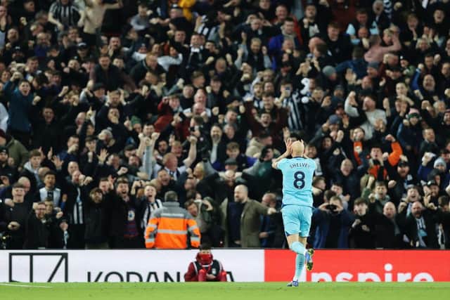 Jonjo Shelvey of Newcastle United celebrates after scoring their side's first goal during the Premier League match between Liverpool and Newcastle United at Anfield on December 16, 2021 in Liverpool, England. (Photo by Clive Brunskill/Getty Images)