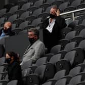 Newcastle United's English owner Mike Ashley (R) watches his side lose the English Premier League football match between Newcastle United and Brighton and Hove Albion at St James' Park in Newcastle upon Tyne, north-east England on September 20, 2020.