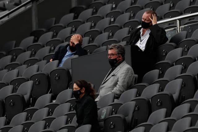 Newcastle United's English owner Mike Ashley (R) watches his side lose the English Premier League football match between Newcastle United and Brighton and Hove Albion at St James' Park in Newcastle upon Tyne, north-east England on September 20, 2020.