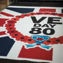Flags are made at the JW Plant Flag Company ahead of the VE Day 80th anniversary on March 18, 2025 in Leeds.